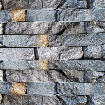 Non-preassembled natural stone strips for cladding